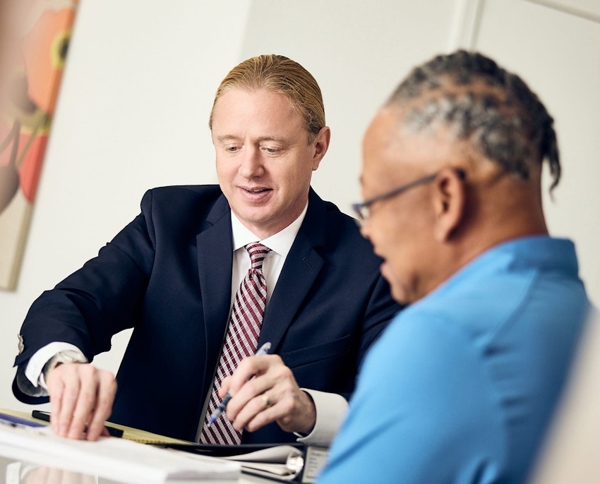 Tyler showing client paperwork