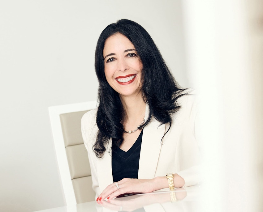 Hella sitting at table