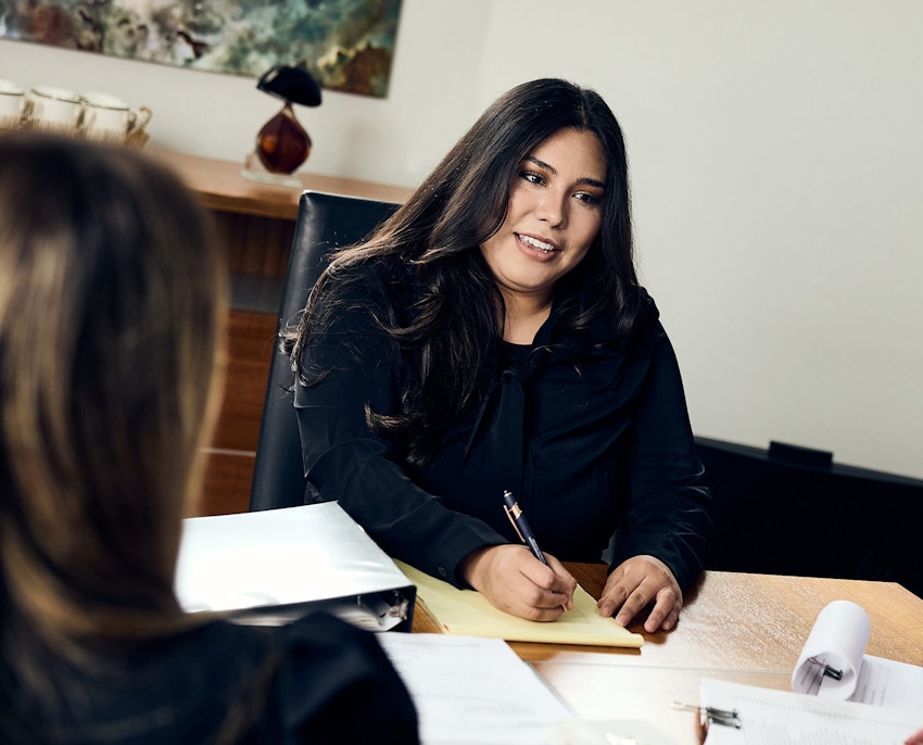 Attorneys sitting together at table