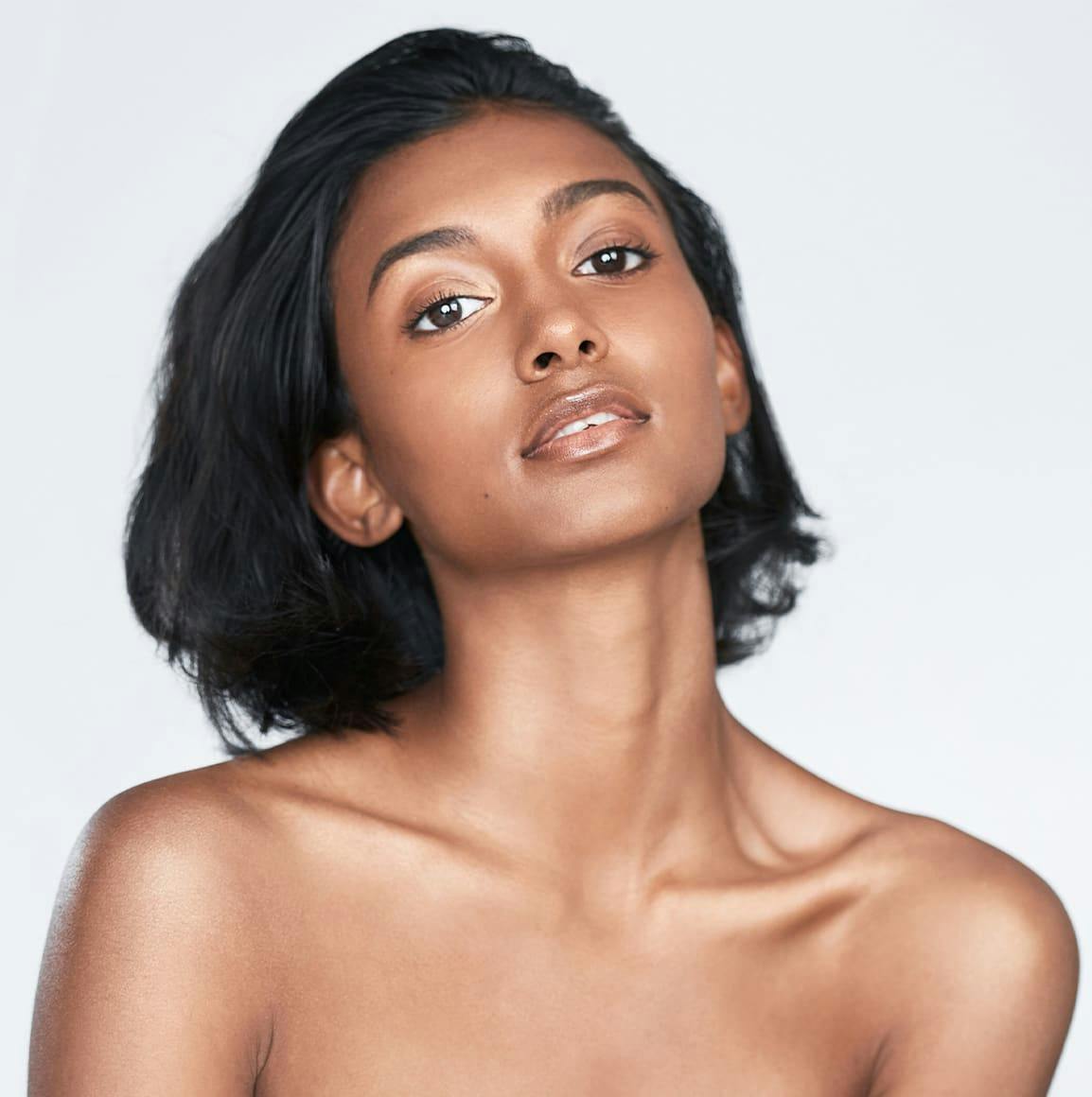 Woman posing against white background