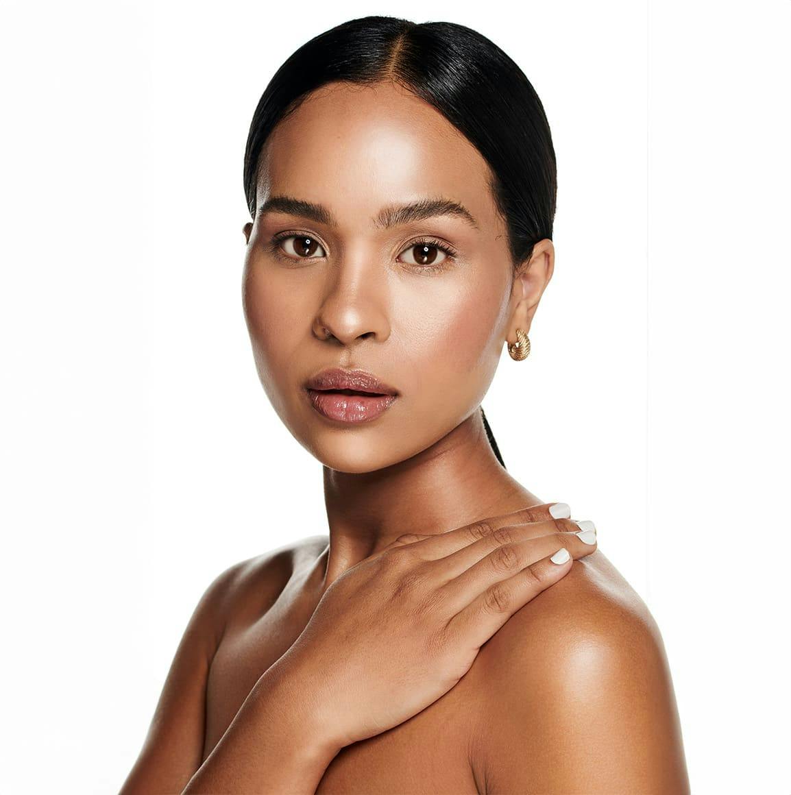 Woman with arm on chest