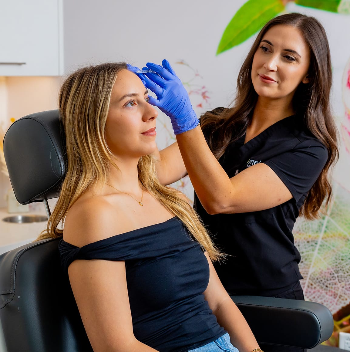 Patient receiving neuromodulator injections from Shannon Dellinger.