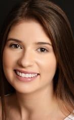female with brown hair smiling