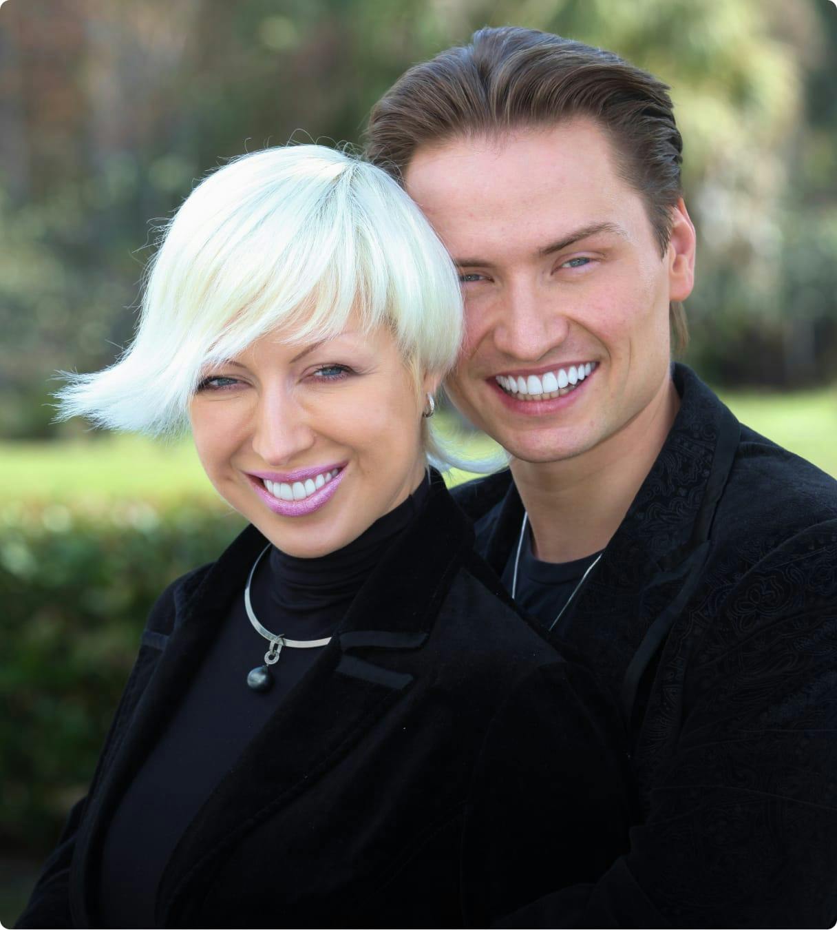 man and woman smiling