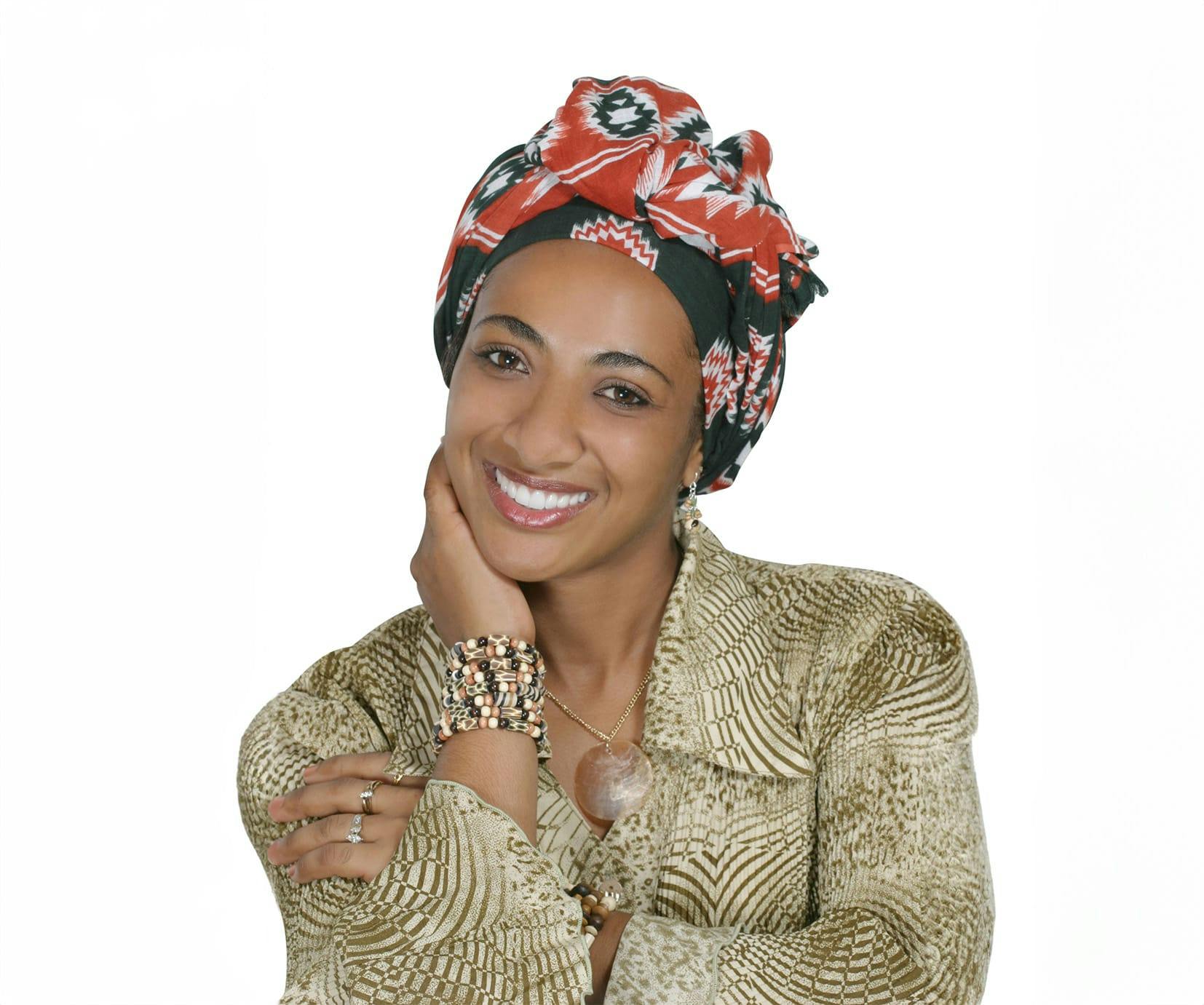 woman wearing a long sleeve top and a scarf over her hair