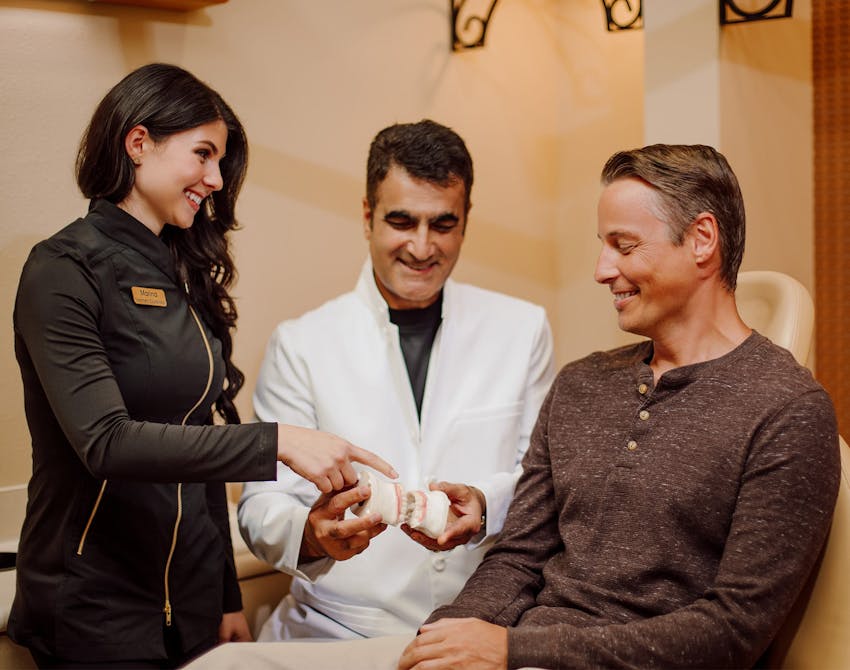 Dr. Sadati with a patient