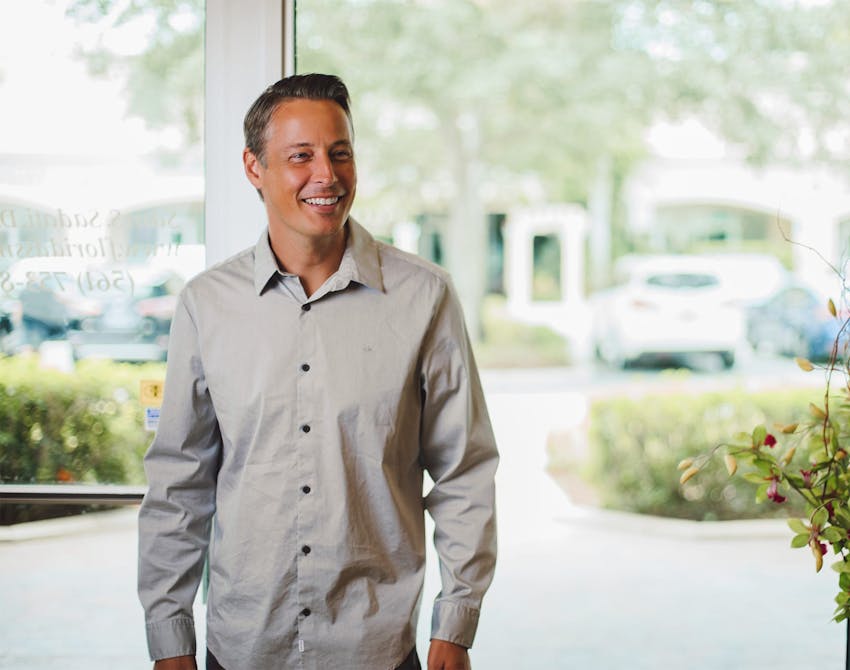 man in a long sleeve button up top