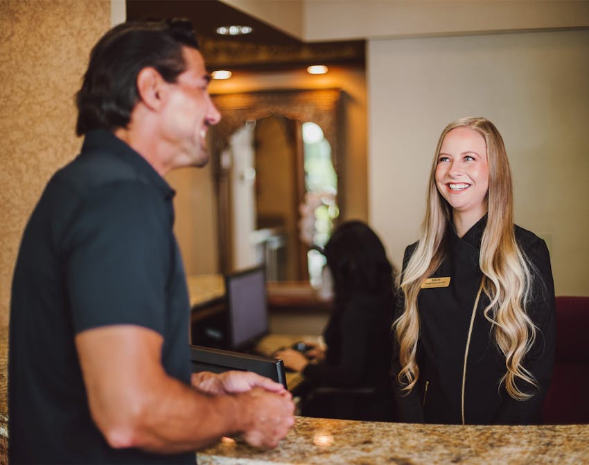 patient speaking with receptionist