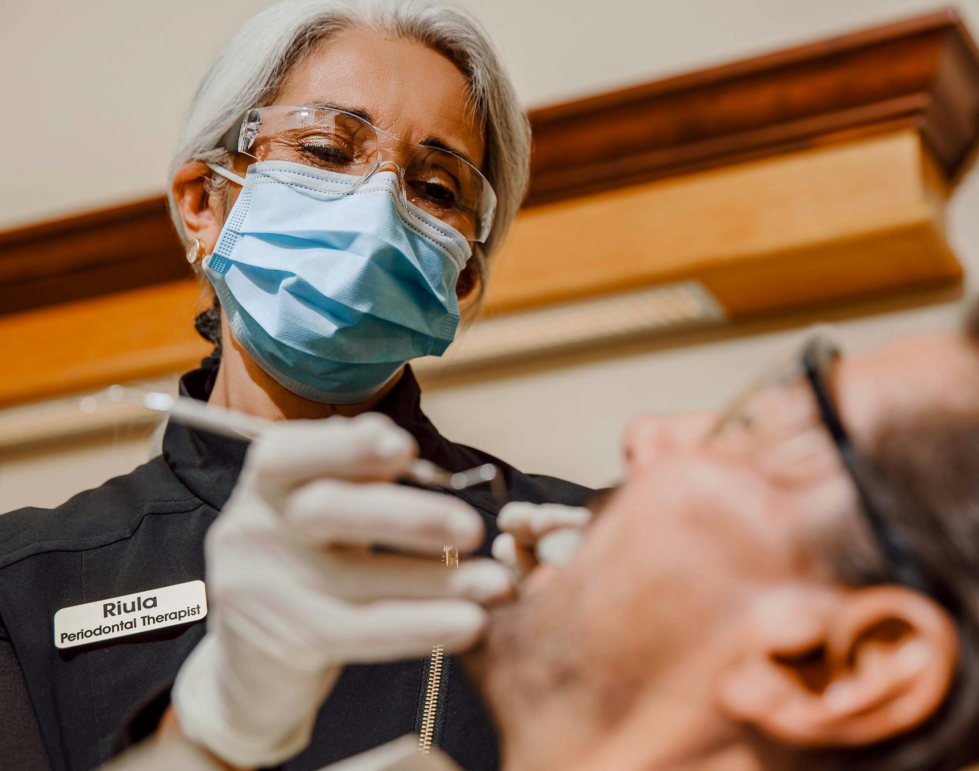 Dr. Sadati with a female patient