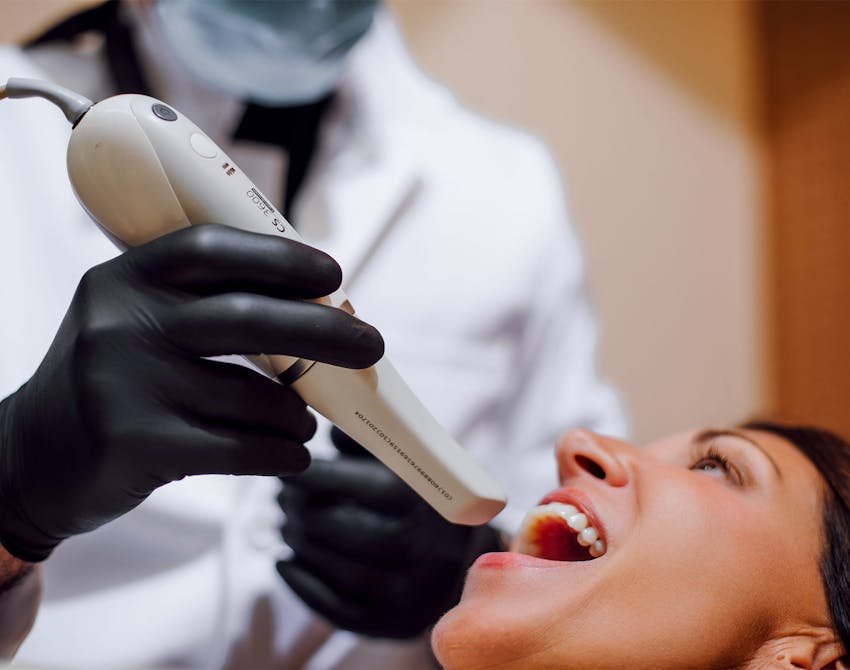 Dr. Sadati working on a dental patient