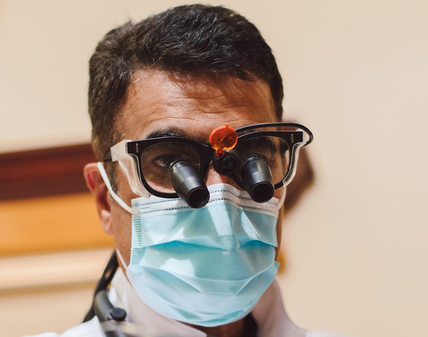 Dr. Sam Sadati with special magnifying glasses