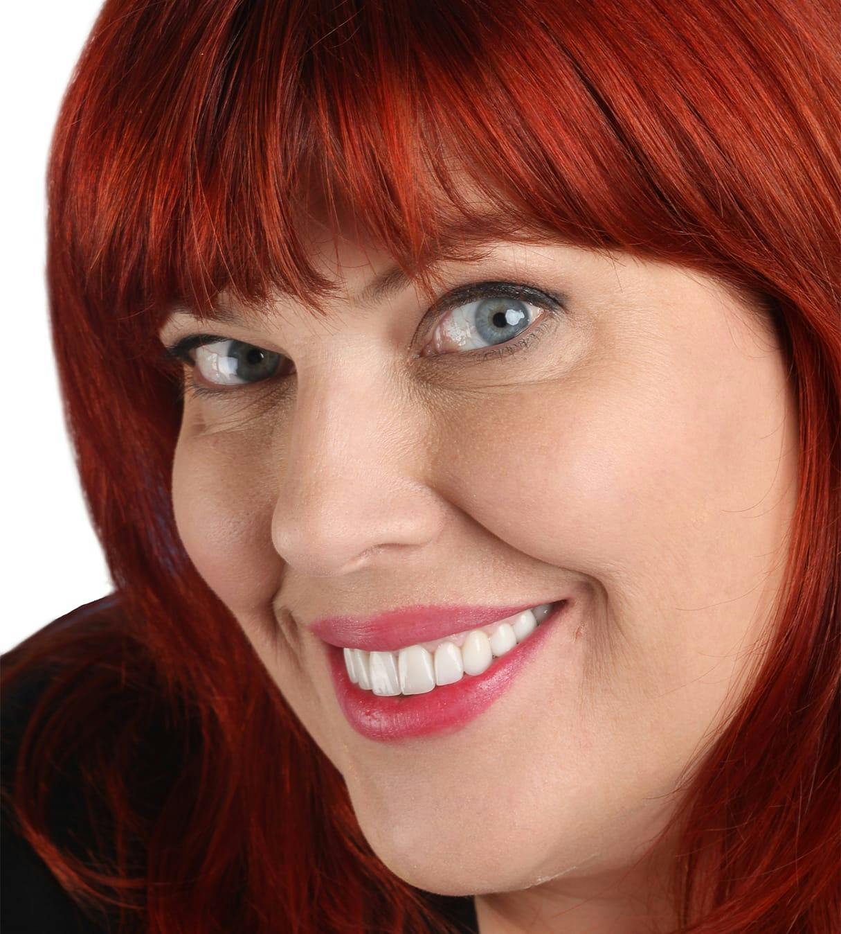 Woman with red hair smiling