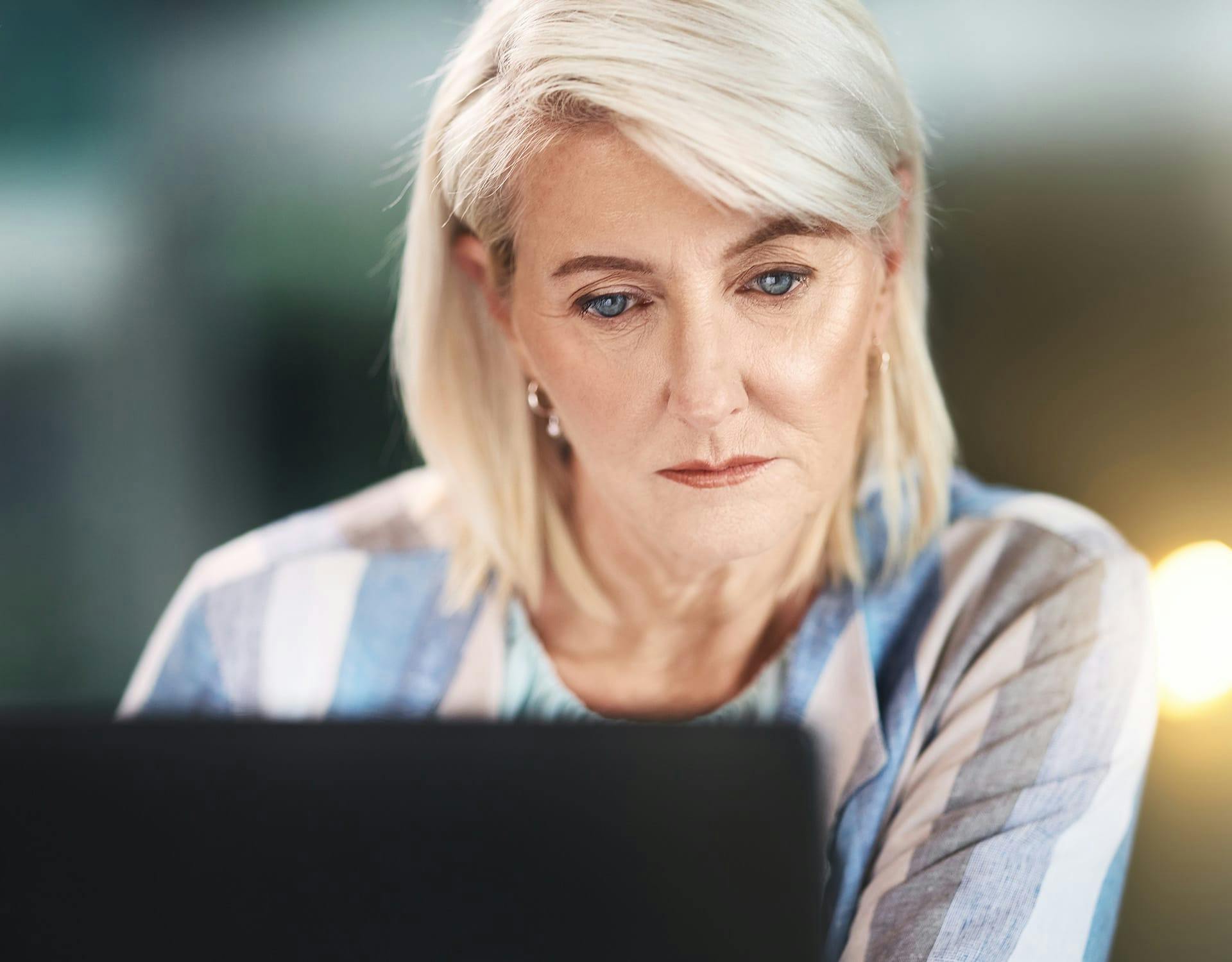 woman looking at a computer