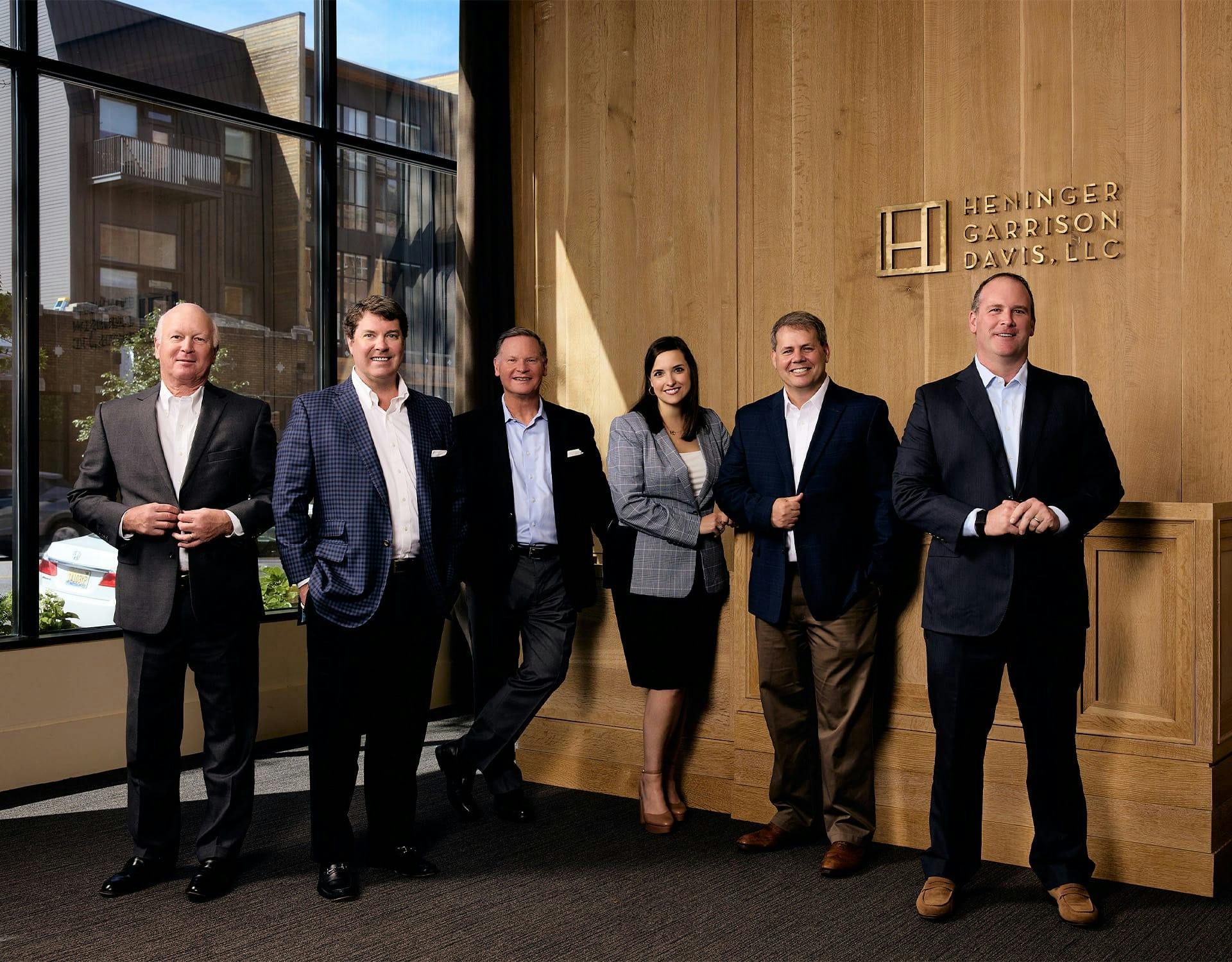 six attorneys standing together