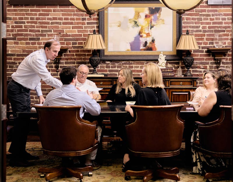 Team at HGD sitting around a table