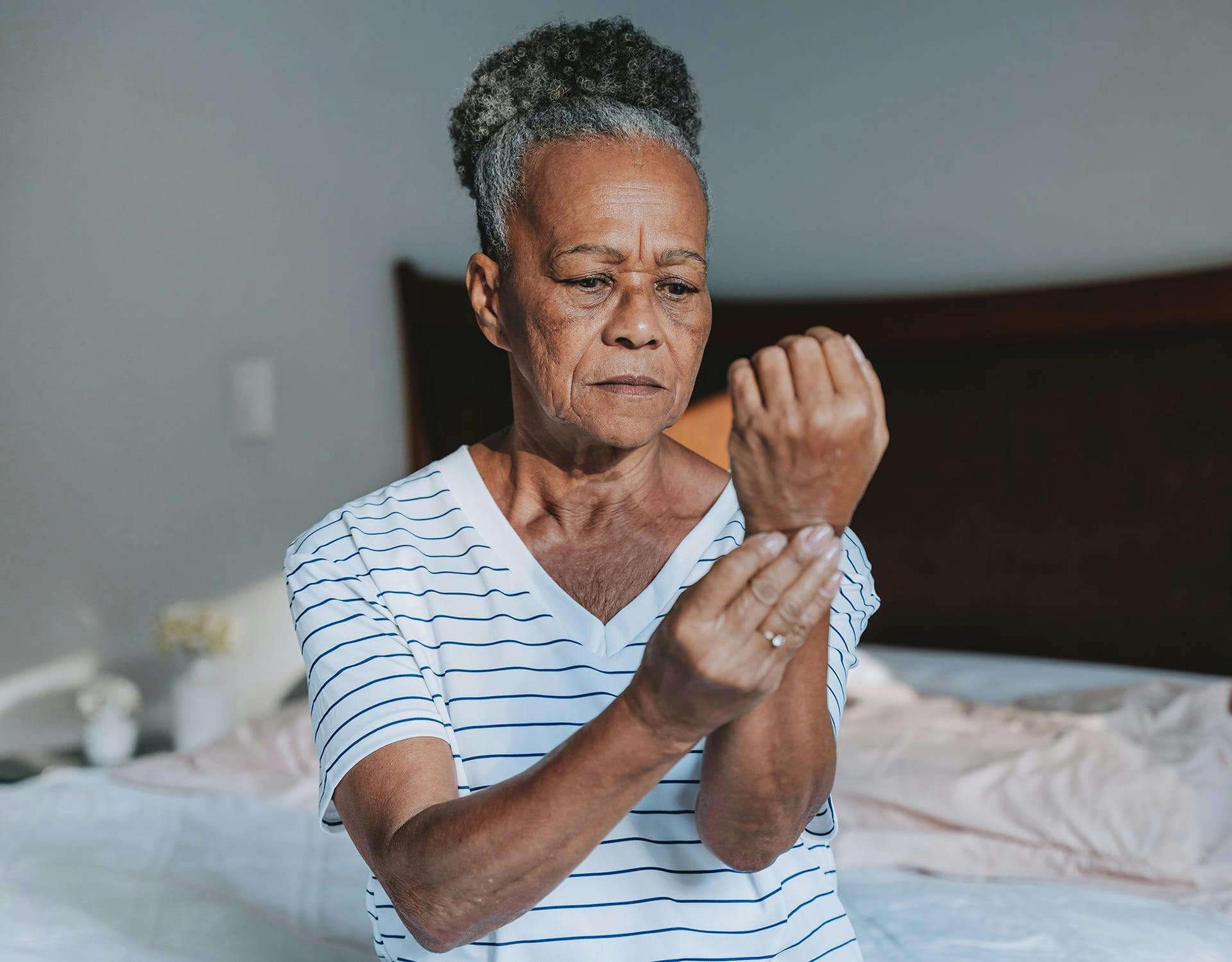 woman holding her wrist