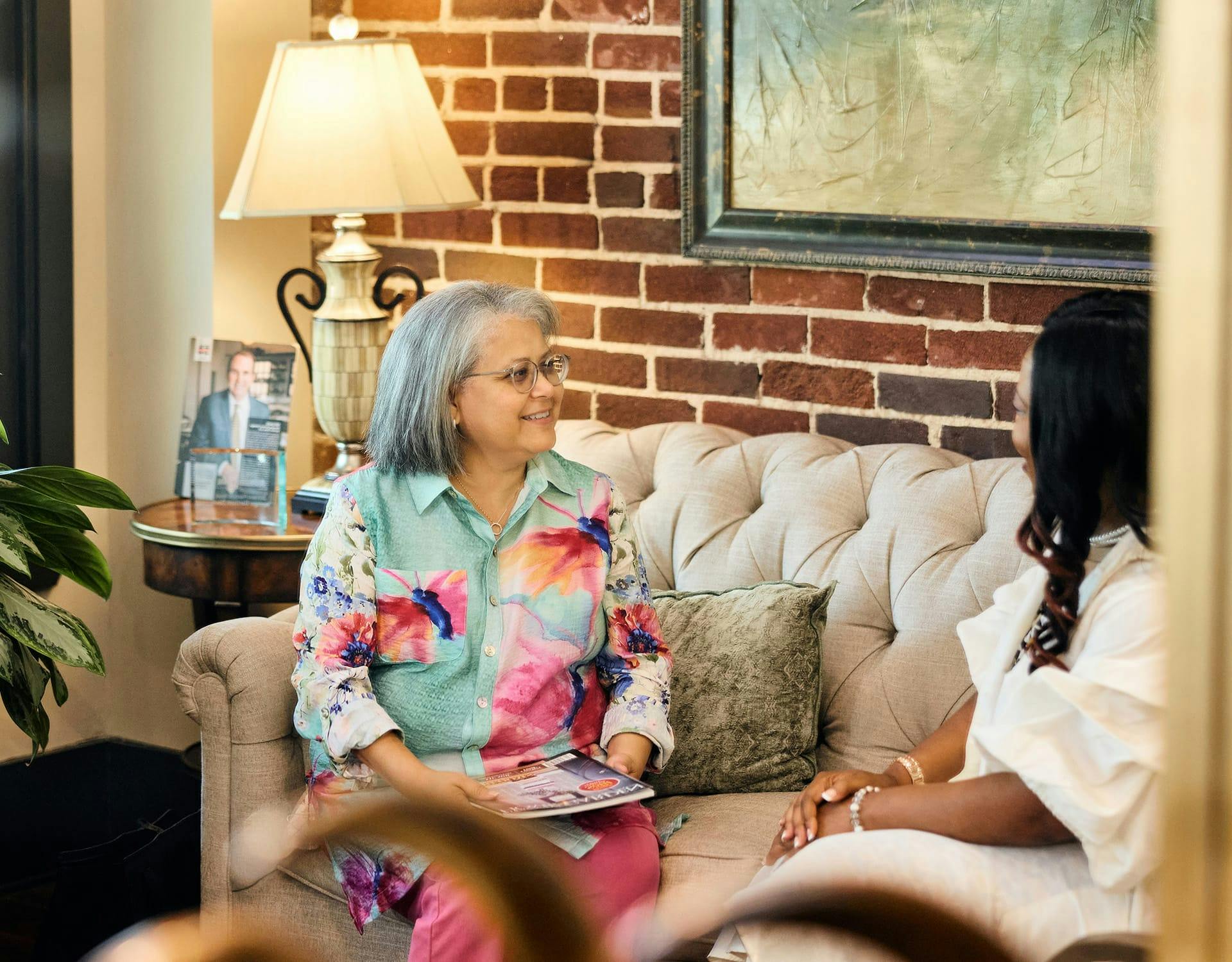 Woman and lawyer sitting on couch
