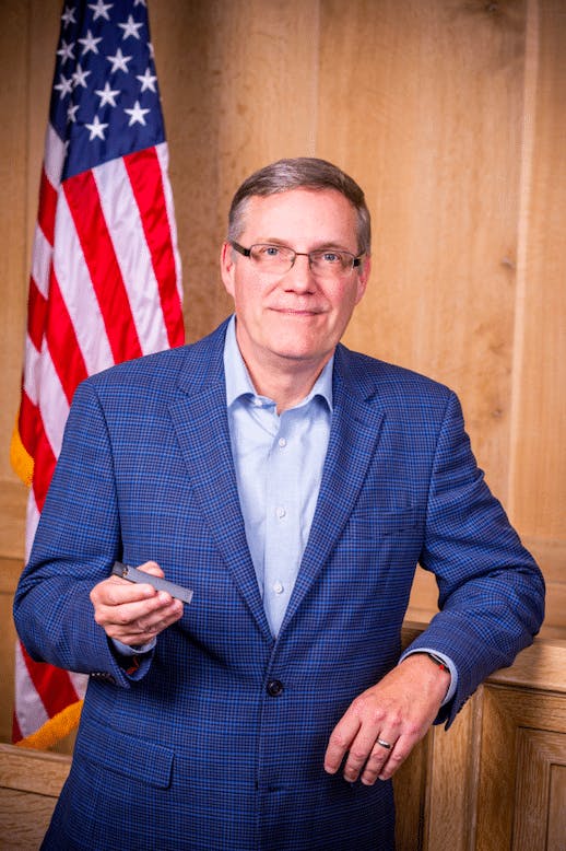 Bill Bross Holding a JUUL e-Cigarette