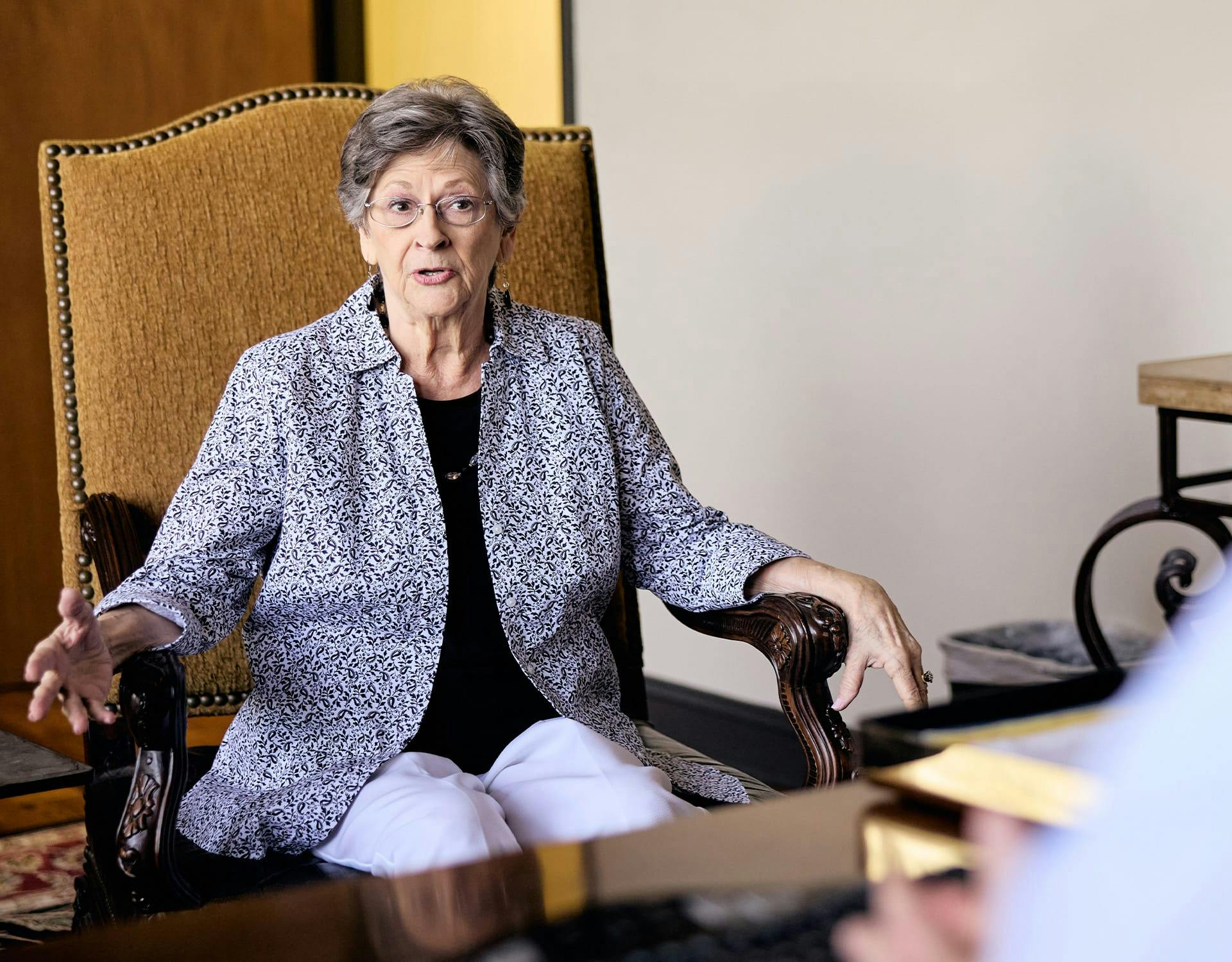 older woman sitting in a chair