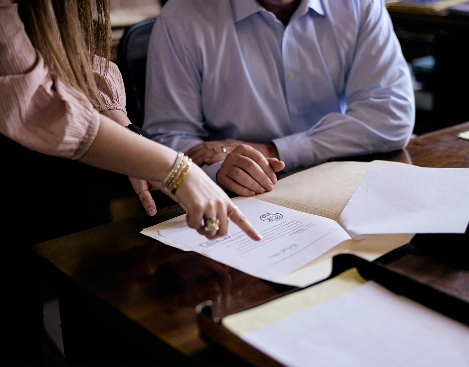 woman pointing to a document