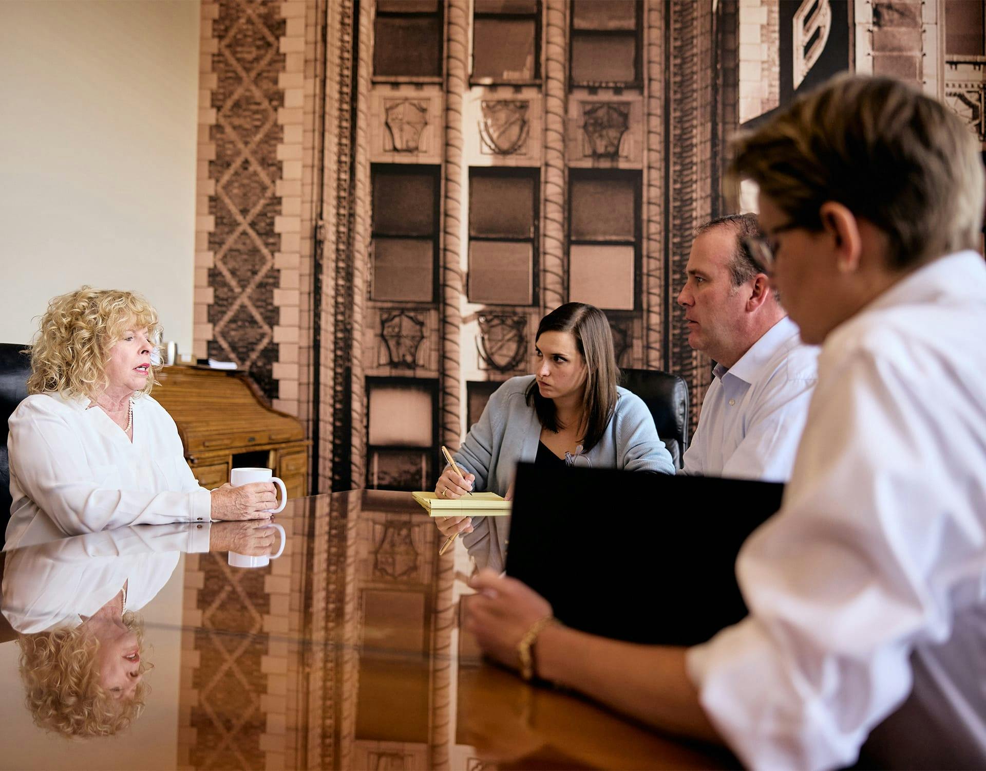 four people around a table