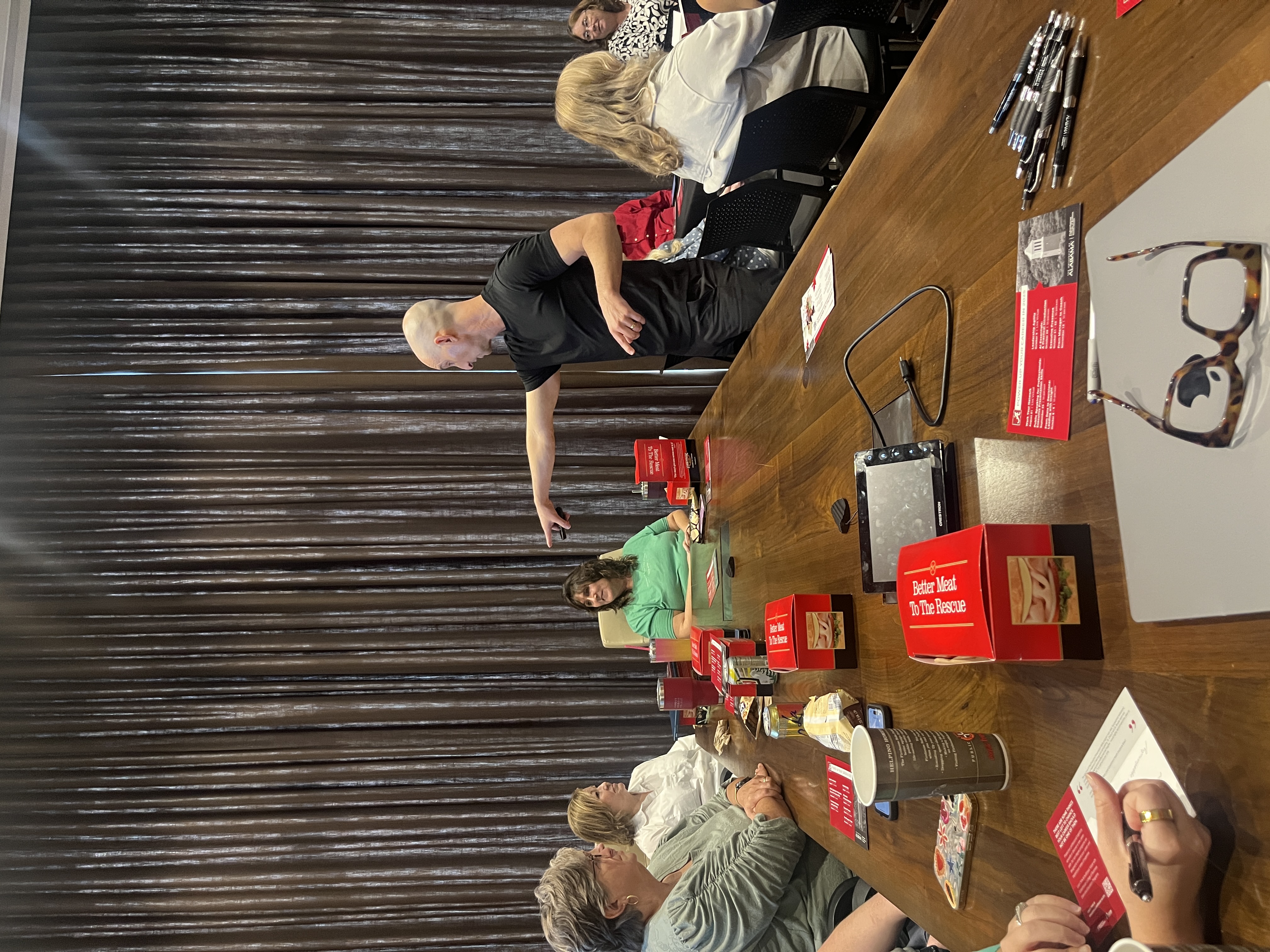 Joe talking to a group at a table