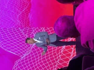 Speaker talking to crowd at Crisp event