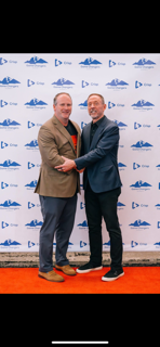 Erik Heninger with a speaker at Crisp event