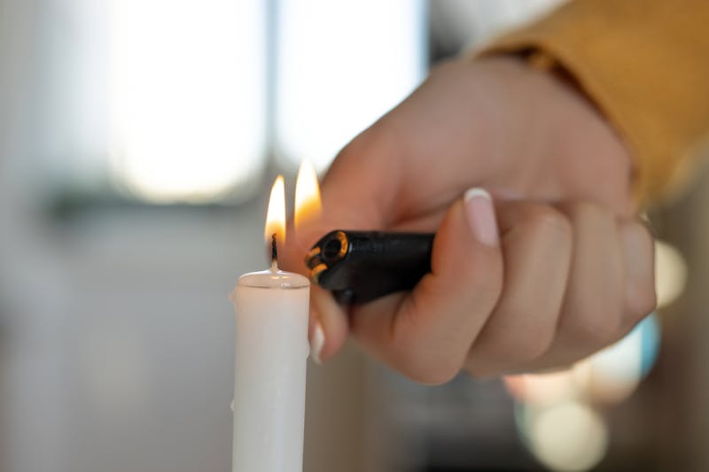 Woman lighting candle