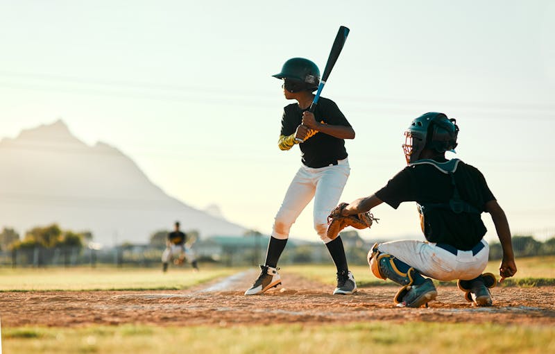 Shot of two baseball players in position during a game