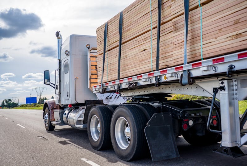 A truck carrying equipment on road