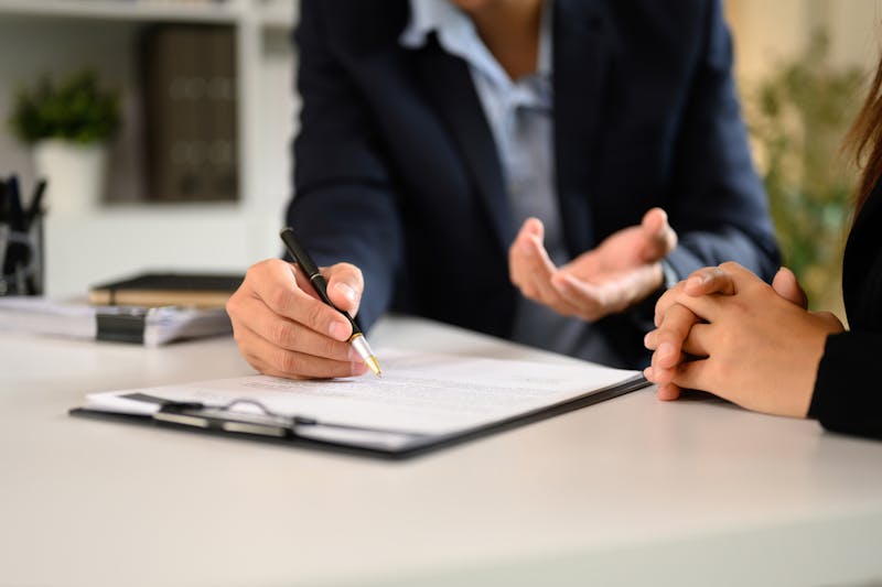A woman speaking to lawyer
