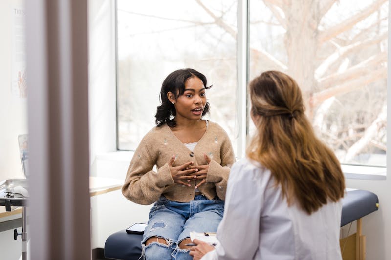 A woman talking to a doctor