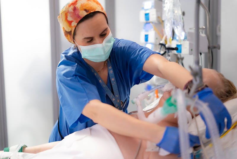 doctor working on an ICU patient