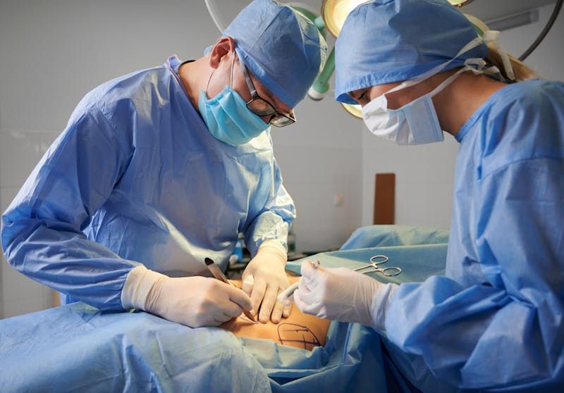 plastic surgeons operating