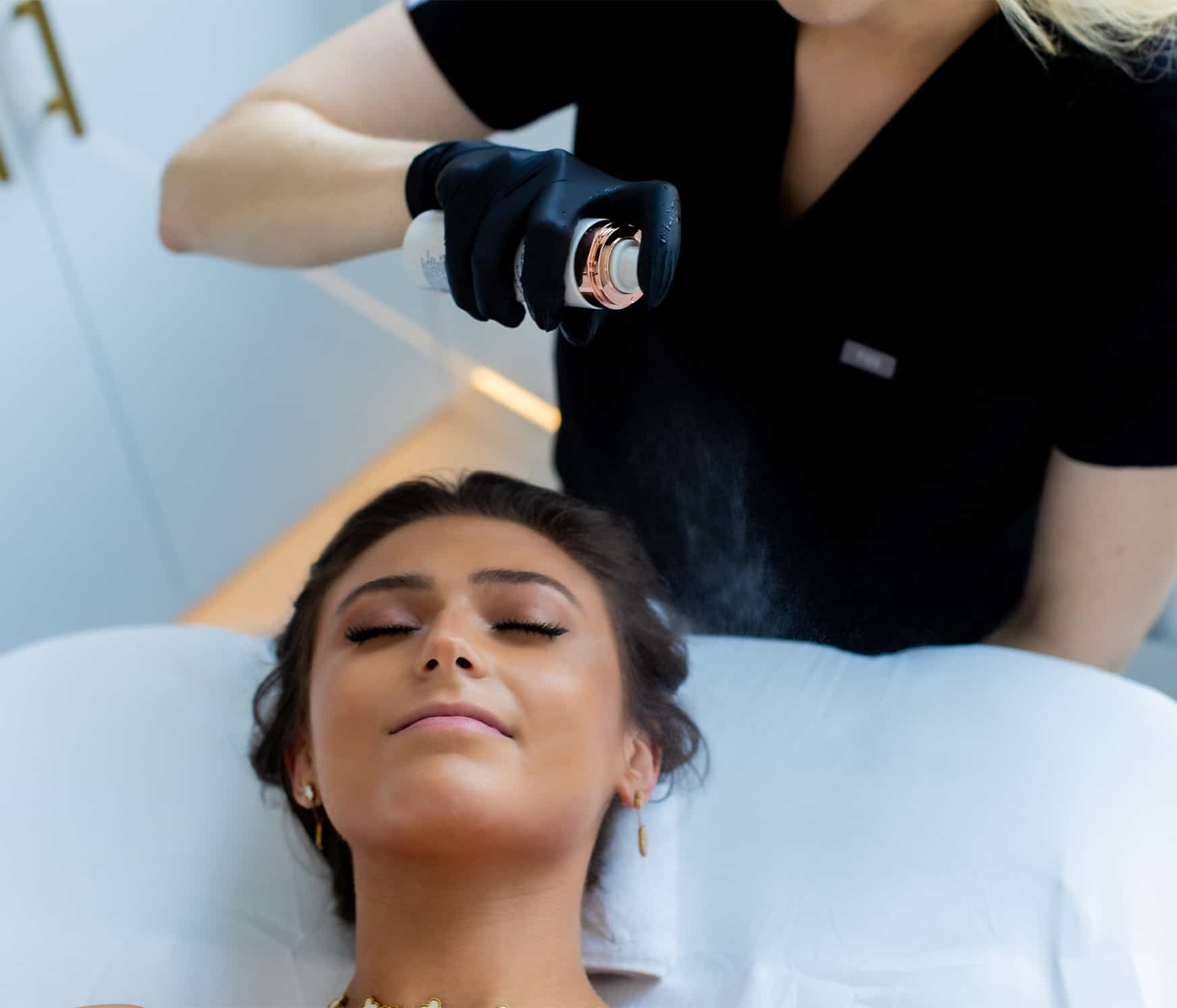 Woman recieving facial peel