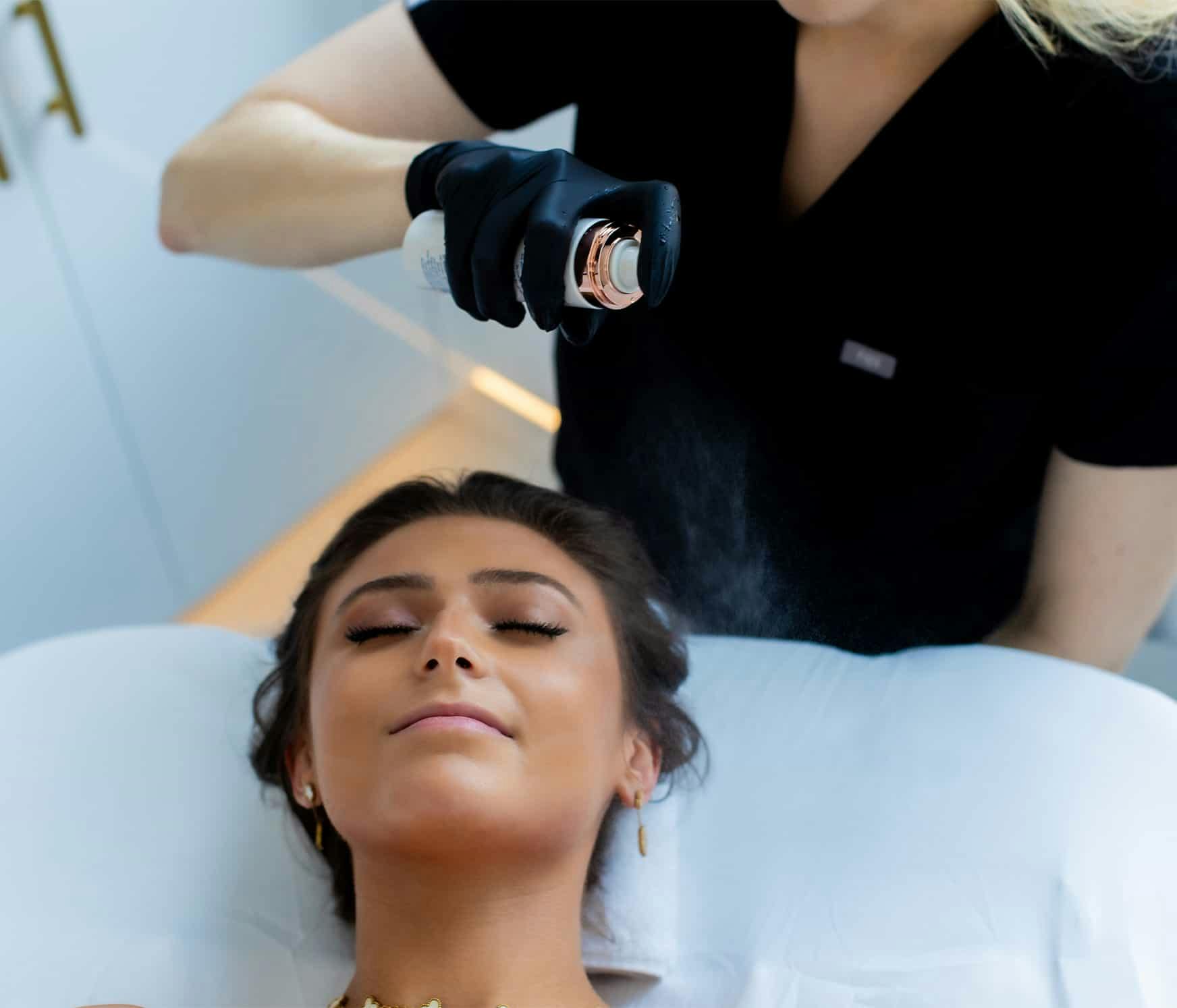 Woman recieving facial peel