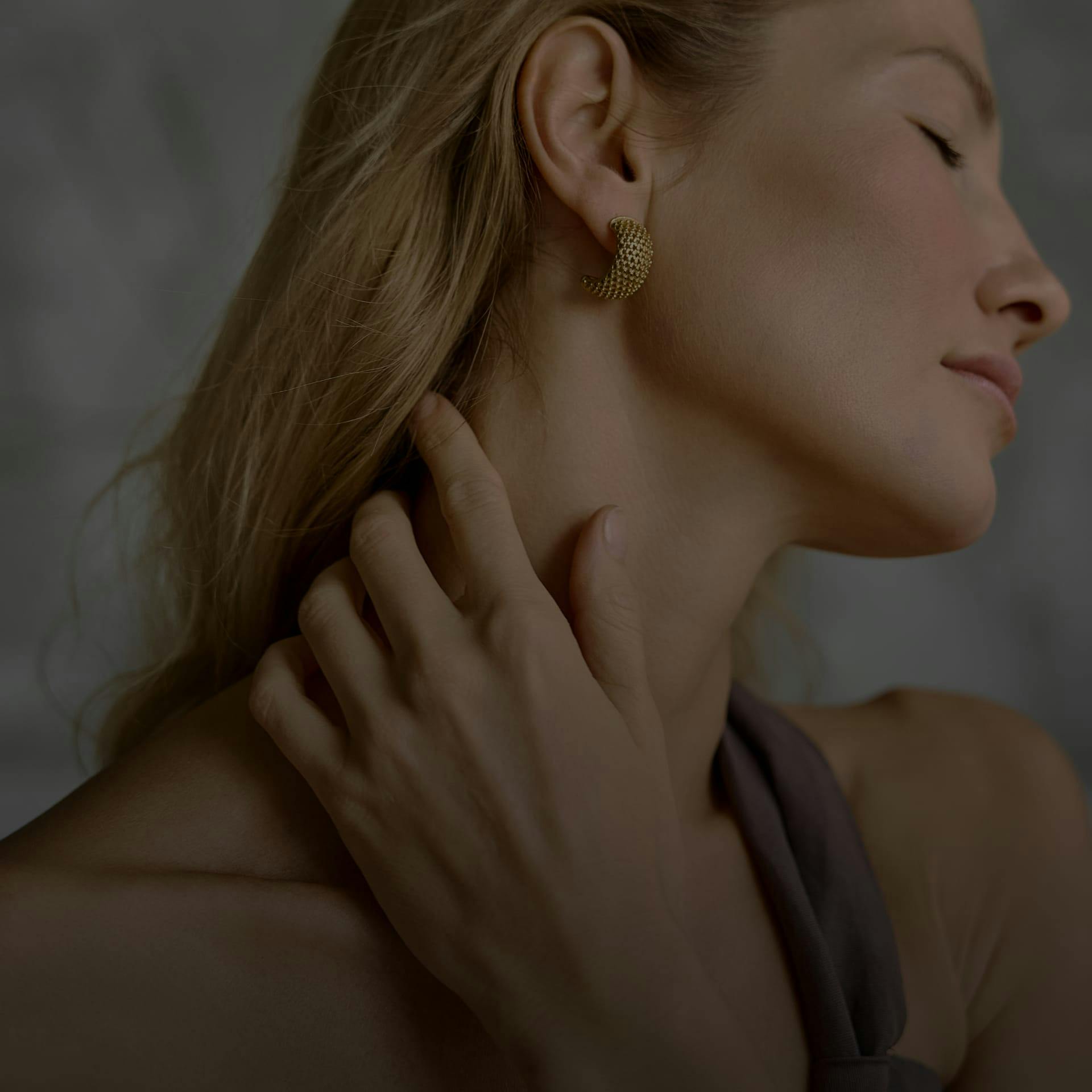 woman touching her neck