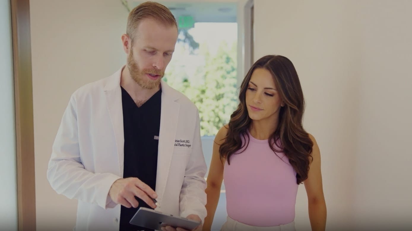 Dr. Brian Scott with a female patient