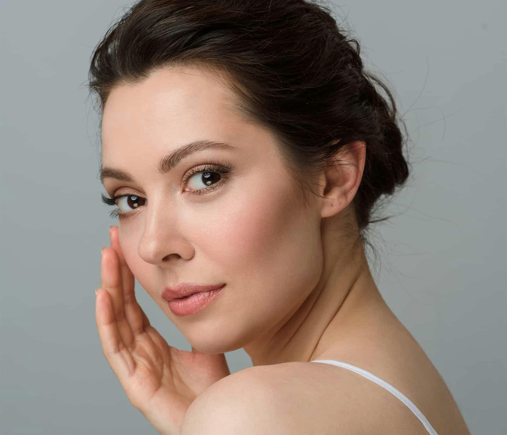 Woman touching face