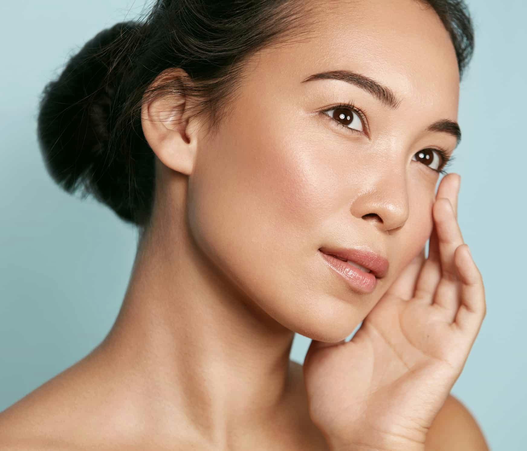 Woman touching face