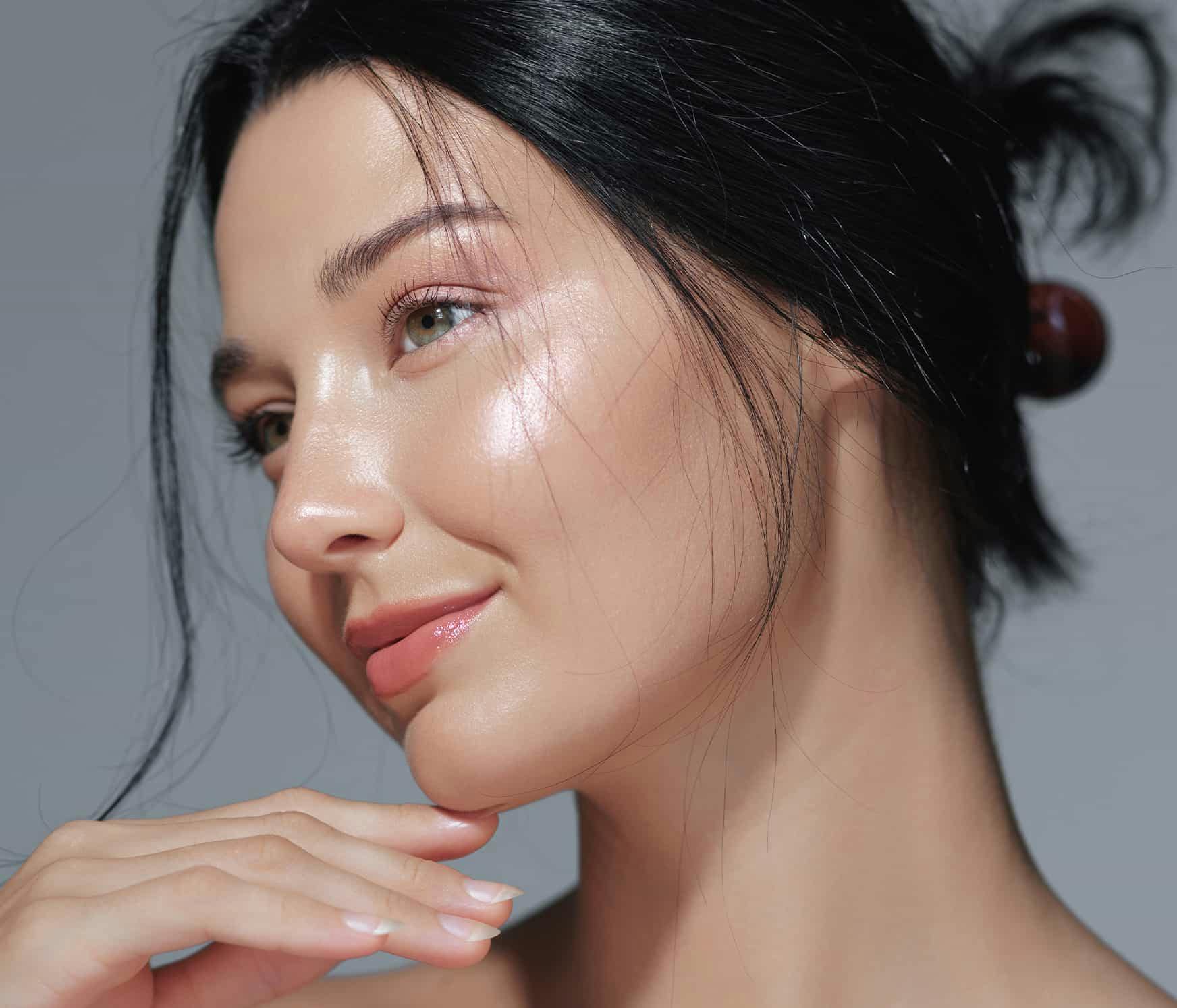 WOman smiling with hand on chin