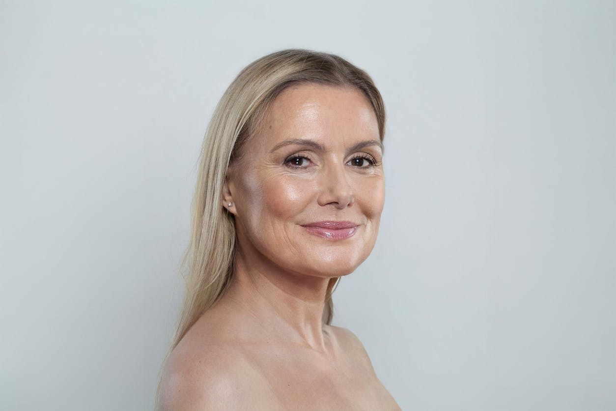 Older blonde woman posing