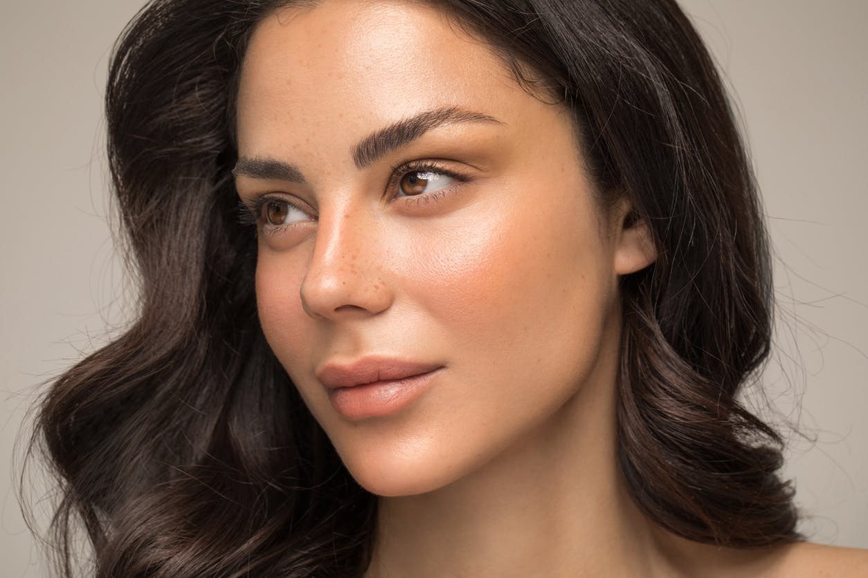 Woman with beautiful eye brows shows potential results of a brow lift in Bellevue