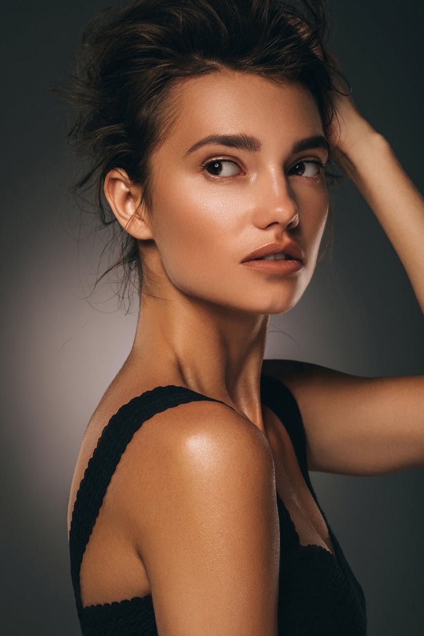 Woman with beautiful cheek bones shows potential results of buccal fat removal in Bellevue