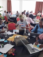 People at a table participating in workshop.