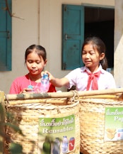 Students recycling their pet bottles, 264 students, 39 teachers and 75 villagers were trained in waste and school garden management.