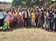 Representatives from various community groups, conservancy managers and residents pose for a picture after one of several community engagement sessions by the Wyss Academy for Nature Hub East Africa.