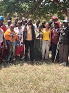 Representatives from various community groups, conservancy managers and residents pose for a picture after one of several community engagement sessions by the Wyss Academy for Nature Hub East Africa.
