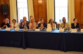 Roundtable participants applauding.